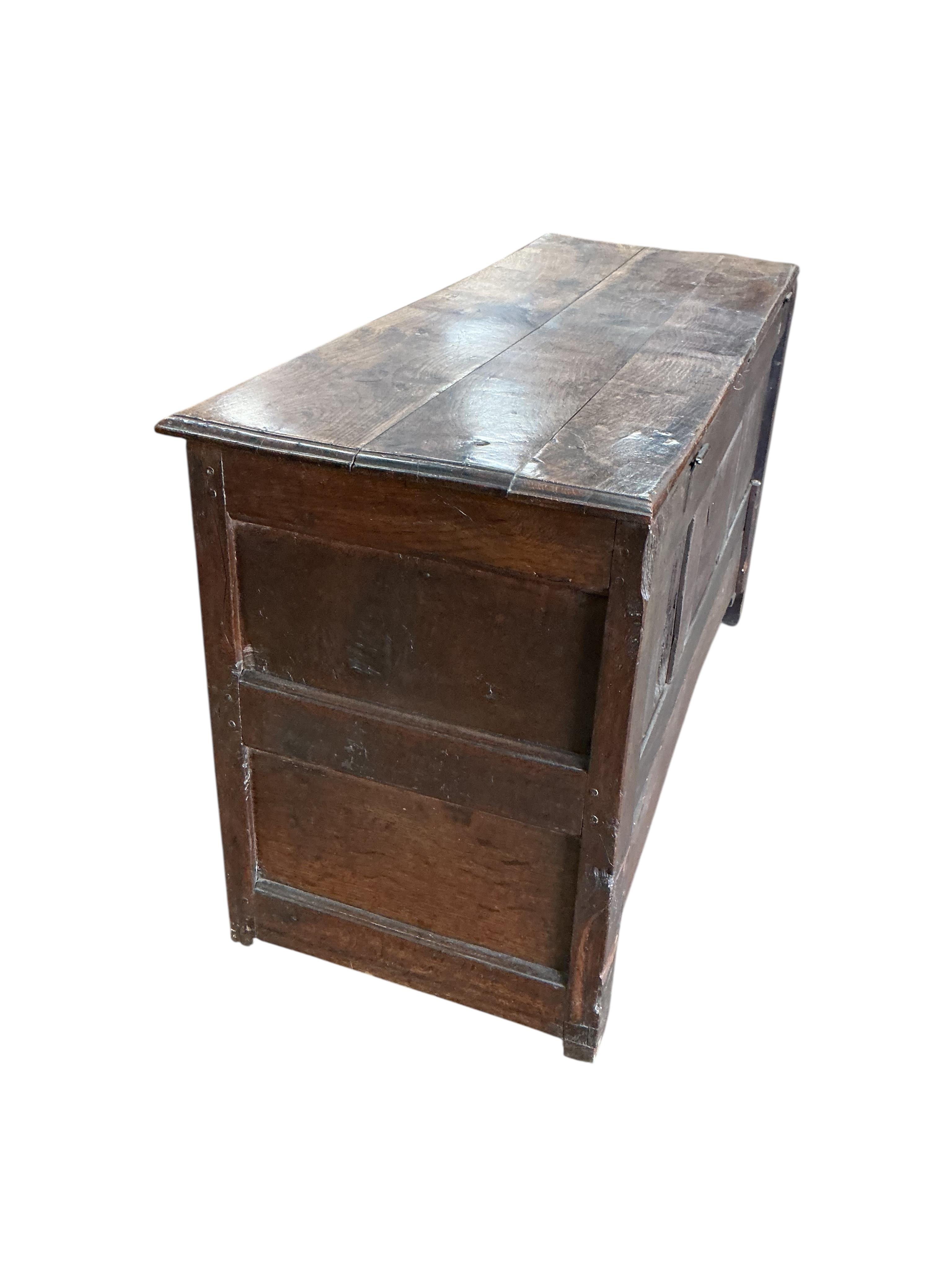 An early 18th century panelled oak mule chest, width 126cm, depth 48cm, height 68cm